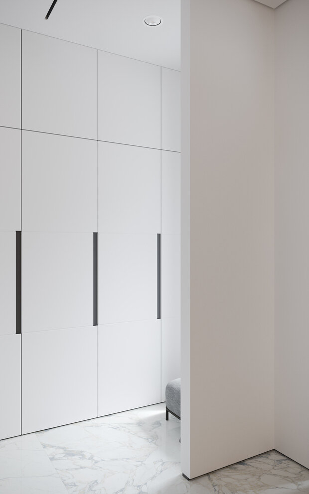 Интерьер гардеробной в стиле минимализм с белыми шкафами