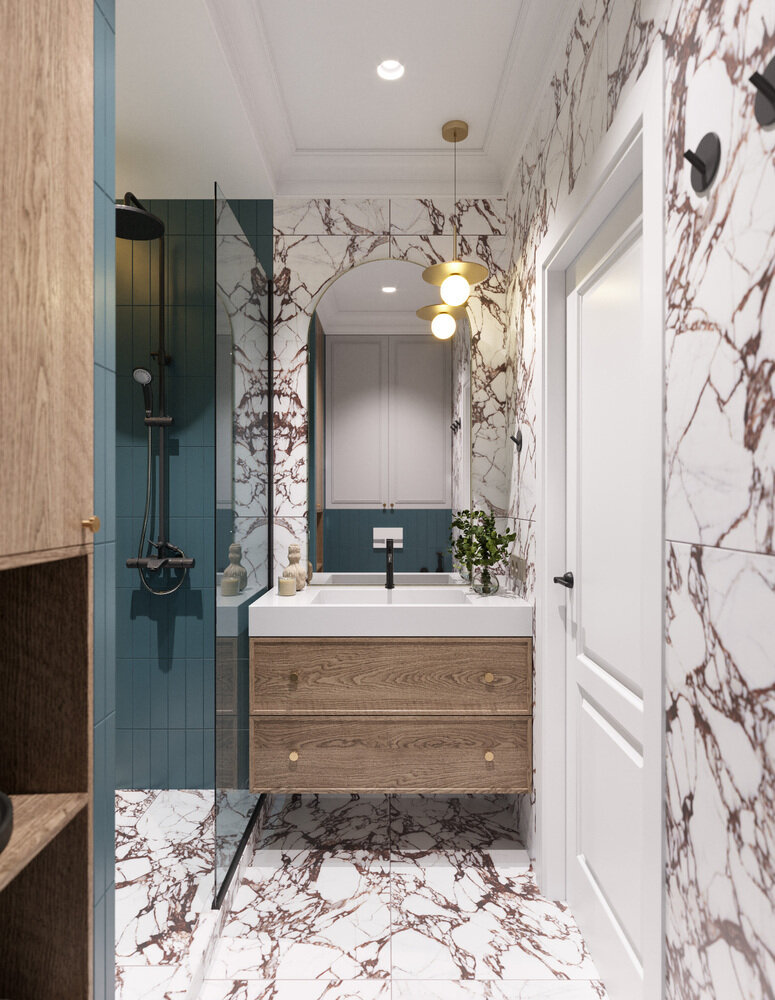 В отделке использовали сочетание мрамора с красноватыми прожилками и мелкоформатной плитки синего оттенка. Над раковиной — арочное зеркало в латунной раме и подвес для камерного освещения. В отделке использовали сочетание мрамора с красноватыми прожилками и мелкоформатной плитки синего оттенка. Над раковиной — арочное зеркало в латунной раме и подвес для камерного освещения.
