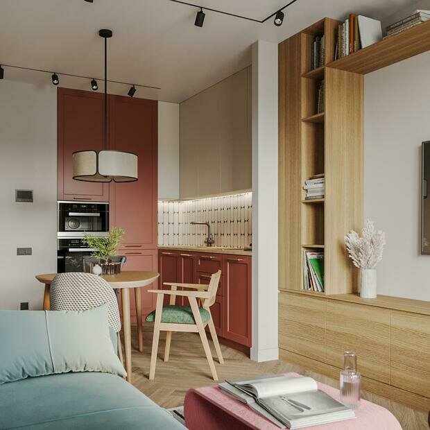 Домофон расположен в кухне-гостиной, а не в прихожей. Такой прием позволяет открывать гостям, не проходя через грязную зону у входной двери.