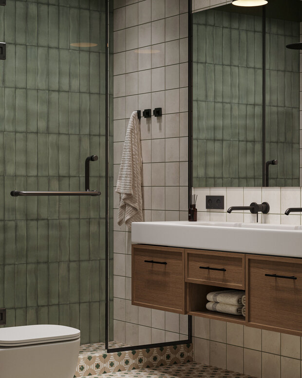 В санузле по запросу заказчиков душевая зона со стеклянной перегородкой и стеклянной дверью.