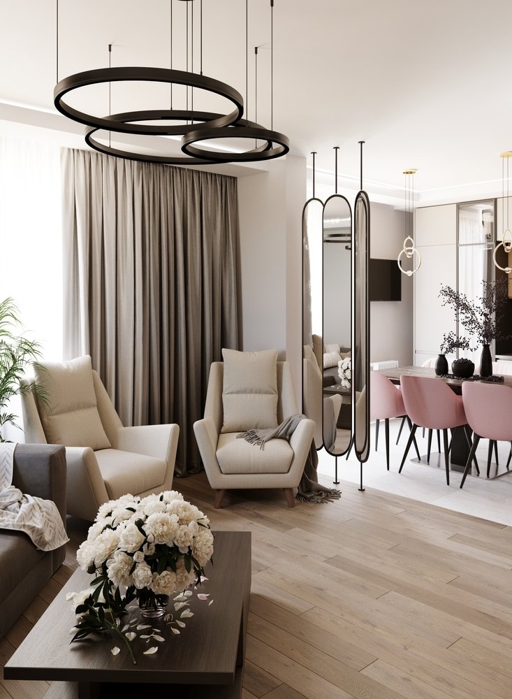 Нужно было организовать посадочные места в гостиной, так как заказчики часто принимают гостей. Угловой диван был главным пожеланием, его сделали в нейтральном сером цвете, а рядом расположились два лаконичных кресла в бежевом оттенке.