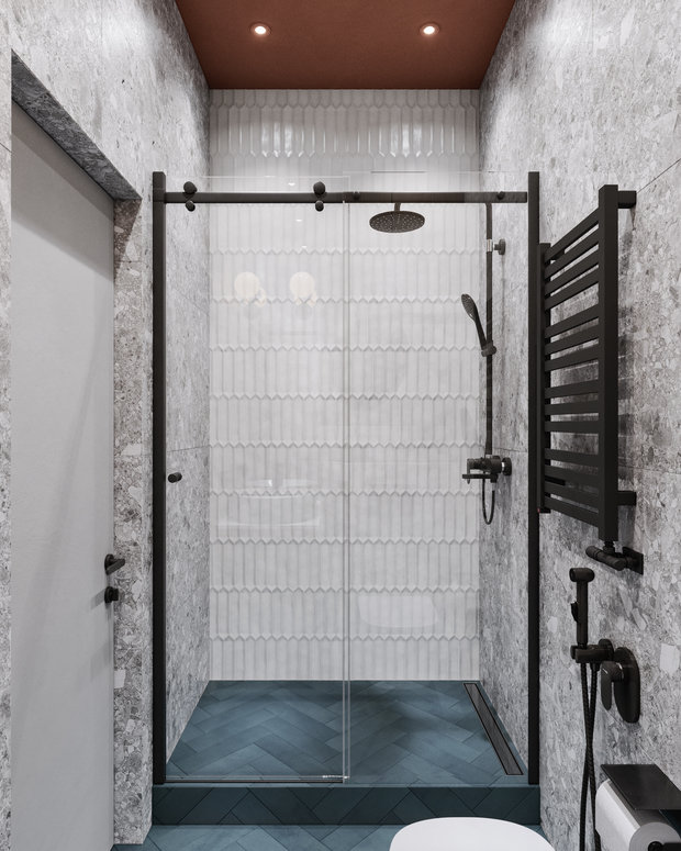 В отделке душевой зоны использовали белую плитку с фартука кухни.