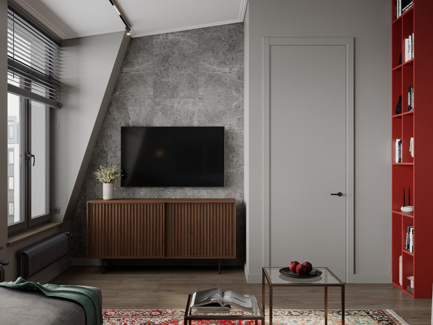 Квартира находится на мансардном этаже, поэтому имеется скос стен, который дизайнер обыграла с помощью отделки. Двери сделали максимально незаметными.